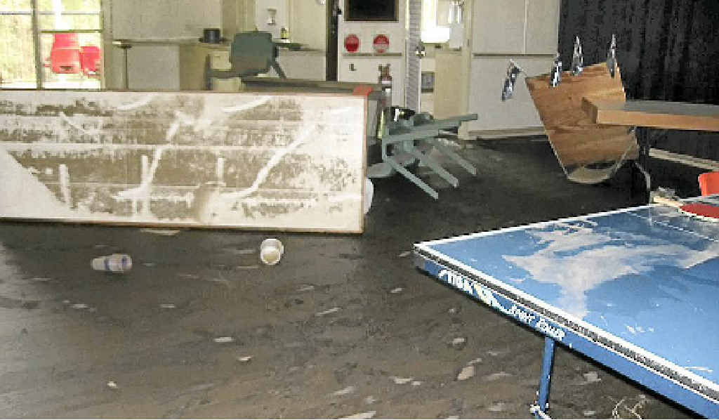 Mud, slosh and water damage inside the newly rebuilt Woolooga Hall. Mud, slosh and water damage inside the newly rebuilt Woolooga Hall.